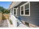 Charming home exterior with gray siding, white trim, and inviting front entrance at 930 23Rd N Ave, St Petersburg, FL 33704