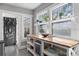 Bright kitchen area with a central island, ample shelving, and view to the backyard at 930 23Rd N Ave, St Petersburg, FL 33704