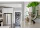 Modern kitchen with stainless steel appliances and a blackboard door leading to a pantry at 930 23Rd N Ave, St Petersburg, FL 33704