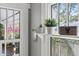 Bright windows with white trim showcase an array of plants and offer a glimpse to the outdoors at 930 23Rd N Ave, St Petersburg, FL 33704