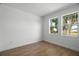 Light-filled bedroom showcasing wood-look flooring and a double window at 930 57Th N Ave, St Petersburg, FL 33703
