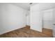 Bright bedroom with wood-look flooring and a closet offering ample storage space at 930 57Th N Ave, St Petersburg, FL 33703