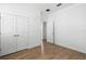 Bedroom featuring wood-look tile flooring and closet at 930 57Th N Ave, St Petersburg, FL 33703