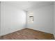 Cozy bedroom with wood-look tile flooring and a bright window at 930 57Th N Ave, St Petersburg, FL 33703
