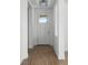 Bright entryway featuring a white front door and beautiful wood-look tile flooring at 930 57Th N Ave, St Petersburg, FL 33703