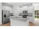 Modern kitchen with white cabinetry, granite countertops, and stainless steel appliances at 930 57Th N Ave, St Petersburg, FL 33703