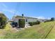 A well-maintained backyard with an orderly row of shrubbery, offering a neat and private outdoor space at 9740 45Th N St, Pinellas Park, FL 33782