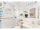 Bright bathroom featuring a tub, shower, and a modern sink and faucet with a clean white finish at 9740 45Th N St, Pinellas Park, FL 33782