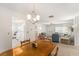 Spacious dining room leading to the living room and kitchen, perfect for entertaining guests at 9740 45Th N St, Pinellas Park, FL 33782