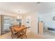 Open dining room featuring a wooden table and chairs, with a view into the adjacent living area at 9740 45Th N St, Pinellas Park, FL 33782