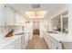 Efficient kitchen with modern appliances and ample counter space, offering views to the dining area at 9740 45Th N St, Pinellas Park, FL 33782