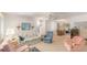 Inviting living room with plush seating, ceiling fan, and decorative accents, creating a comfortable and stylish space at 9740 45Th N St, Pinellas Park, FL 33782