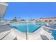 Beautiful community pool featuring multiple chairs for relaxation at 9740 45Th N St, Pinellas Park, FL 33782