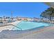 Large in ground pool with clean shimmering water, surrounded by lounge seating at 9740 45Th N St, Pinellas Park, FL 33782