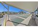 Covered shuffleboard courts with benches provide community members outdoor recreation at 9740 45Th N St, Pinellas Park, FL 33782