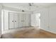 Bedroom featuring a large closet with bi-fold doors and a ceiling fan, ready to be customized at 10035 63Rd N Ave # 12, St Petersburg, FL 33708