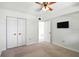 Bedroom featuring a closet with bi-fold doors and a ceiling fan, ready to be customized for comfort and style at 10035 63Rd N Ave # 12, St Petersburg, FL 33708