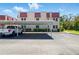 Exterior of building with assigned parking and well-maintained landscaping at 10035 63Rd N Ave # 12, St Petersburg, FL 33708
