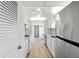 Clean kitchen with stainless steel appliances, tile backsplash, and light wood-look flooring at 10035 63Rd N Ave # 12, St Petersburg, FL 33708