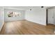 Bright living room features wood-look flooring, recessed lighting, and a large window at 10035 63Rd N Ave # 12, St Petersburg, FL 33708