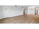Spacious living room featuring wood-look flooring, recessed lighting, and ample natural light at 10035 63Rd N Ave # 12, St Petersburg, FL 33708