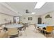 Multipurpose room with round tables, chairs, and ceiling fan at 10035 63Rd N Ave # 12, St Petersburg, FL 33708