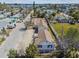 Neighborhood aerial view with charming cottage-style homes, sunny street at 103 146Th E Ave, Madeira Beach, FL 33708