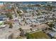 Aerial view showcasing a charming residential area with diverse homes and lush landscaping at 103 146Th E Ave, Madeira Beach, FL 33708
