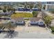 Neighborhood aerial view with charming cottage-style homes, sunny street at 103 146Th E Ave, Madeira Beach, FL 33708