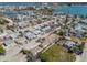 An aerial view captures a dense residential neighborhood with waterfront access at 103 146Th E Ave, Madeira Beach, FL 33708