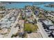 Aerial view of closely-knit neighborhood with the bay in the background at 103 146Th E Ave, Madeira Beach, FL 33708