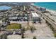 A stunning aerial view of a coastal community, showing the beach, road, and the ocean at 103 146Th E Ave, Madeira Beach, FL 33708