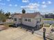 Aerial view of a quaint home featuring green shutters, convenient parking, and outdoor space at 103 146Th E Ave, Madeira Beach, FL 33708