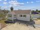 Aerial view of a quaint home featuring green shutters, convenient parking, and outdoor space at 103 146Th E Ave, Madeira Beach, FL 33708