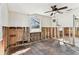 Bedroom featuring hardwood floors needing refurbishment, and a ceiling fan at 103 146Th E Ave, Madeira Beach, FL 33708