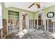 Bedroom needing renovation offering customization, with ceiling fan and bathroom access at 103 146Th E Ave, Madeira Beach, FL 33708
