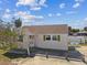 Aerial view of a quaint home with green shutters, ample parking and near the beach at 103 146Th E Ave, Madeira Beach, FL 33708
