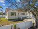 Exterior shot showcasing a charming home with a white picket fence and well-maintained landscaping at 103 146Th E Ave, Madeira Beach, FL 33708
