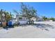 Charming exterior view of a well-kept home with a white picket fence and beautiful landscaping at 103 146Th E Ave, Madeira Beach, FL 33708