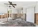 Spacious living room with original hardwood floors needing repairs and updates at 103 146Th E Ave, Madeira Beach, FL 33708