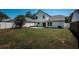 Well-maintained backyard with lush green grass, enclosed by a white privacy fence at 10906 Kenbrook Dr, Riverview, FL 33578