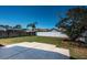 Spacious backyard featuring a large concrete patio and privacy fence at 10906 Kenbrook Dr, Riverview, FL 33578