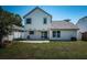 Exterior shot of home with a large grassy backyard and white privacy fence at 10906 Kenbrook Dr, Riverview, FL 33578