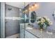 Well-appointed bathroom with a glass-enclosed shower, sleek vanity, and modern fixtures, offering a spa-like experience at 10906 Kenbrook Dr, Riverview, FL 33578