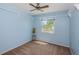 Bedroom with neutral carpet, light blue walls, a window and ceiling fan at 10906 Kenbrook Dr, Riverview, FL 33578