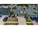 Aerial front view of home featuring a two-car garage and well-kept landscaping at 10906 Kenbrook Dr, Riverview, FL 33578