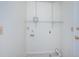 Utility room ready for laundry appliances with hookups and shelf for storage at 10906 Kenbrook Dr, Riverview, FL 33578