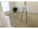 Spacious living room with plush carpeting and ample natural light, ready for personalization at 10906 Kenbrook Dr, Riverview, FL 33578