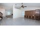Bright living room with vaulted ceilings, ceiling fan, and built-in entertainment center at 10906 Kenbrook Dr, Riverview, FL 33578