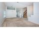 Spacious living room with neutral decor, chandelier, staircase and access to multiple rooms at 10906 Kenbrook Dr, Riverview, FL 33578